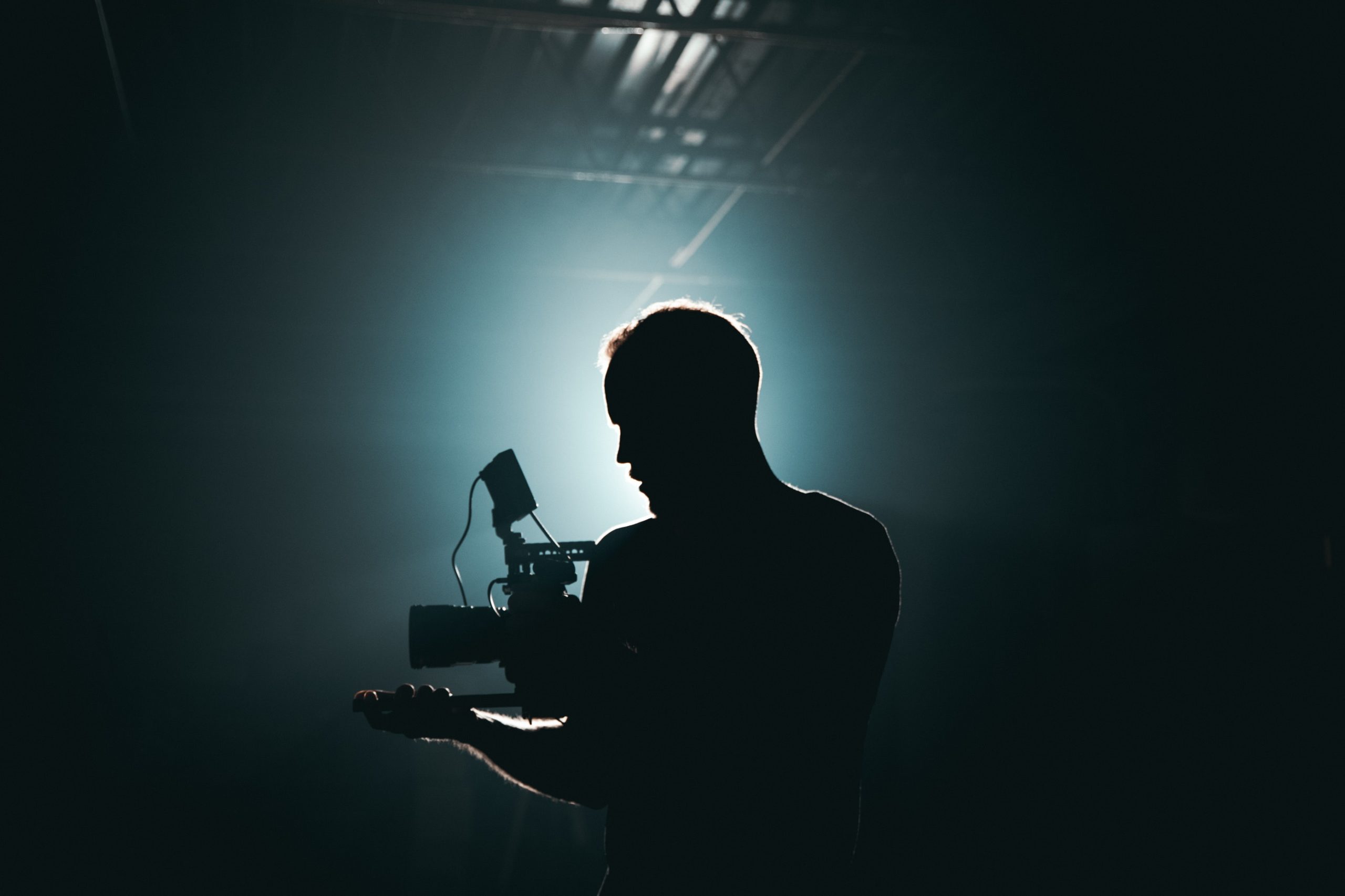 Camera operator filming with a professional cinema camera